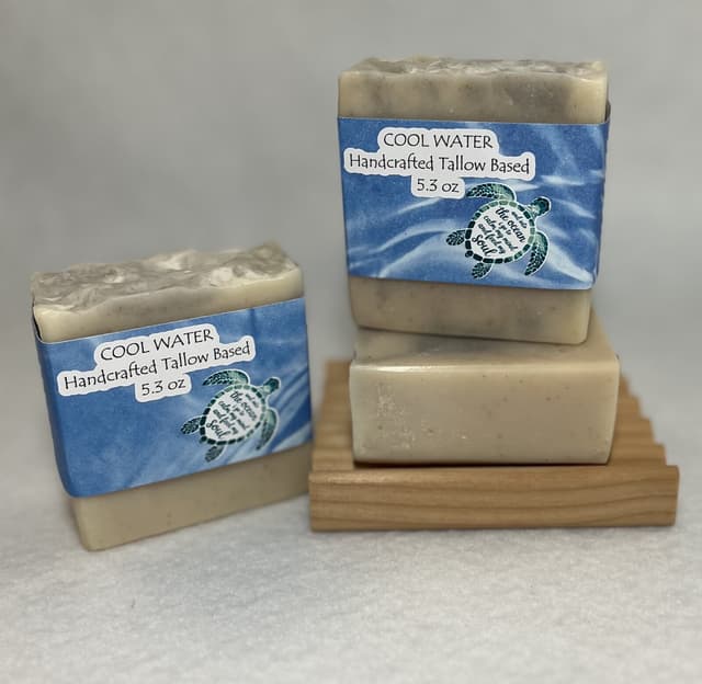 Cool Water bars in blue sea-turtle labels on a wooden soap tray