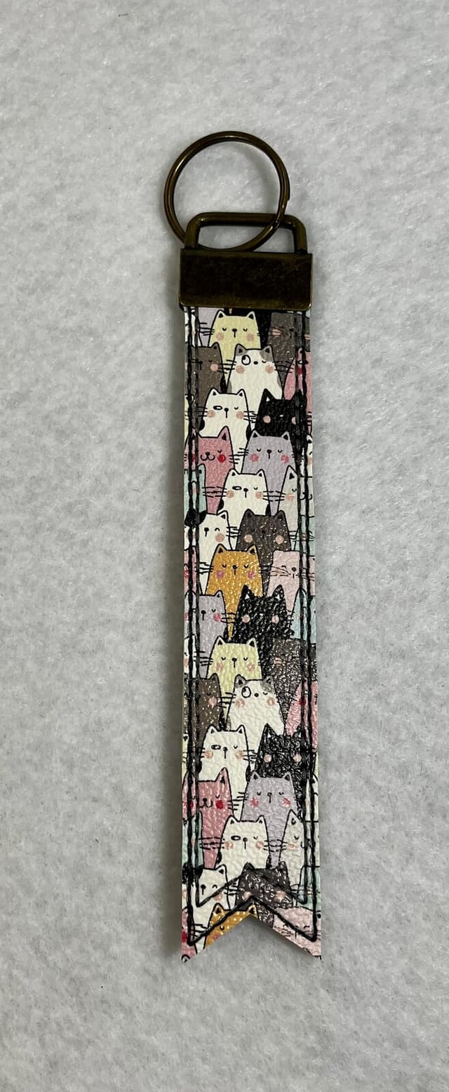Vinyl wristlet keychain printed with cats