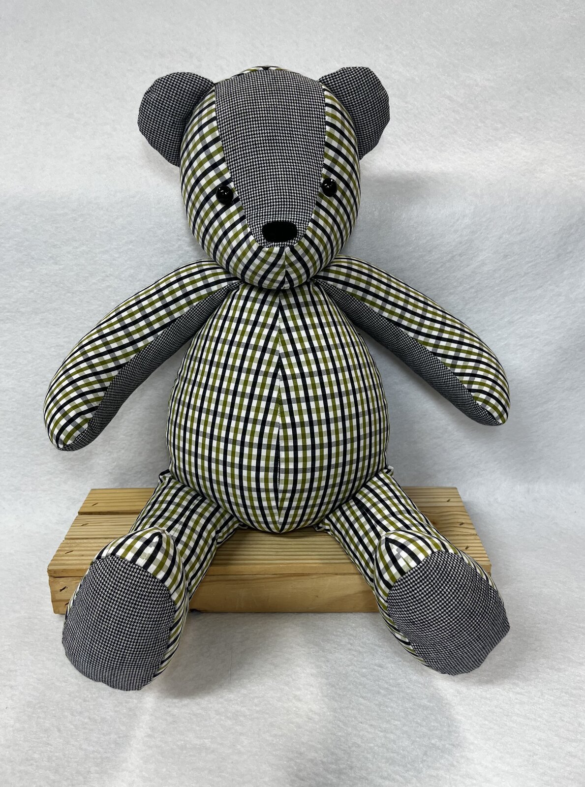 Memory bear sewn from a yellow and navy checked shirt