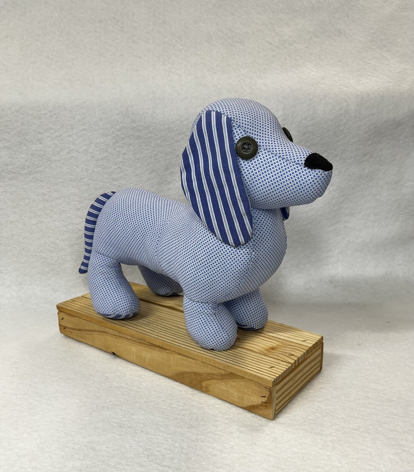 Memory dog sewn from a blue striped shirt